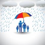 Father Protecting Family From Rain Stock Photo