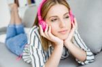 Beautiful Young Woman Listening To Music At Home Stock Photo