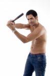 Smiling Strong Man With Wooden Stick Stock Photo