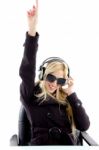Lady Pointing Up With headphone Stock Photo