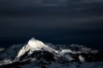 Dark Clouds With White Mountains Stock Photo