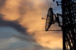 Silhouette Satellite Communication Tower Poles On Sunset Stock Photo