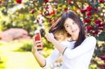 Beautiful Girl Posing For A Selfie With Her Smart Phone Stock Photo
