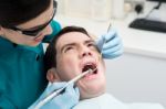 Dentist Treat A Man Teeth Stock Photo