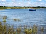 Blue Boat On The River Alde In Suffolk Stock Photo