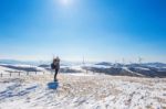 Professional Photographer Takes Photos With Camera In Winter Landscape Stock Photo