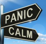 Panic Or Calm Signpost Stock Photo