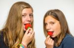 Two Dutch Teenage Girls Eating Strawberries Stock Photo