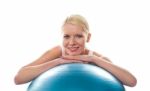Athlete Lady Resting Chin Over Ball Stock Photo