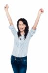 Excited Young Woman Celebrating Her Success Stock Photo