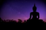 The Milky Way And Silhouette Of Buddha Statue Stock Photo