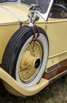 Spare Wheel On A Vintage Yellow Rolls Royce Car Stock Photo