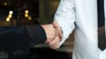 Two Businessman Shaking Hands Greeting Each Other Stock Photo