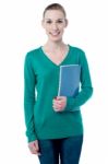 Charming Student Holding Spiral Notebook Stock Photo