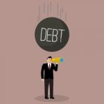 Heavy Debt Falling To Careless Businessman Stock Photo