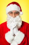 Thoughtful Santa Claus Wearing Eyeglasses Stock Photo