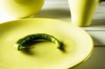 Green Hot Pepper On Dish Stock Photo