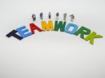 Miniature Bussinessman With Teamwork Word Letters On White Backg Stock Photo