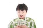 Smiling Boy Counting Money Stock Photo