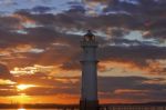 Lighthouse At Sunset Stock Photo