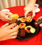 Sharing Cakes And Pastries Stock Photo