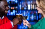 Young Couple At A Bar Celebrating Love Stock Photo