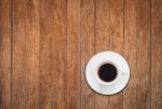Top View Of White Coffee Cup On Wooden Background Stock Photo