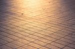 Background Texture Of Tile Roads And The Rays Of The Setting Sun Stock Photo