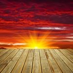 Wooden Deck Floor And Sunset Sky Stock Photo