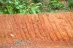 Horizontal Red Cliff Of Small Level Ground Dig A Well Stock Photo
