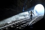 Man Standing In Train Tunnel Stock Photo