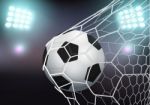 Soccer Ball In The Goal Net Stock Photo