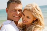 Caucasian Young Couples At Beach Stock Photo
