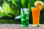 Green Fruit Soda And Orange Juice Stock Photo