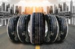 Car Tires In Row On The Street Stock Photo