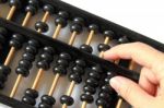 Hand Using A Wooden Abacus  Stock Photo