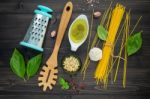 The Thin Spaghetti On Black Wooden Background. Yellow Italian Pa Stock Photo