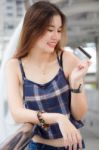 Portrait Of Thai Chinese Adult Beautiful Girl Denim Blue Bag Credit Card Stock Photo