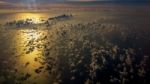 Picture Of Aerial View Over Gulf Of Thailand At Sunset Time. Flying Above The Beautiful Clouds In The Sunset Sky Stock Photo