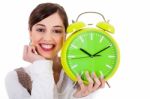 Attractive Young Model Smiling And Holding The Clock Stock Photo