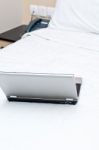 Laptop On Bed Stock Photo