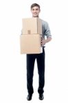 Young Man Holding Cardboard Boxes Stock Photo