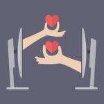 Couple Hands Holding Hearts From Two Computers Stock Photo