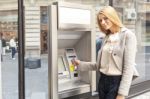 Woman Using Bank ATM Machine Stock Photo