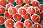 Row Of Red Candles In Small Trays Stock Photo