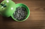 Many Metal Ring Pull In Green Plastic Cup Stock Photo