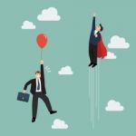 Businessman Superhero Fly Pass Businessman With Red Balloon Stock Photo