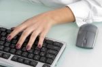 female Hand Operating Keyboard Stock Photo