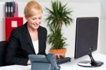 Executive Woman Working At The Office Stock Photo