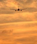 Airplane Flying In Sky Stock Photo